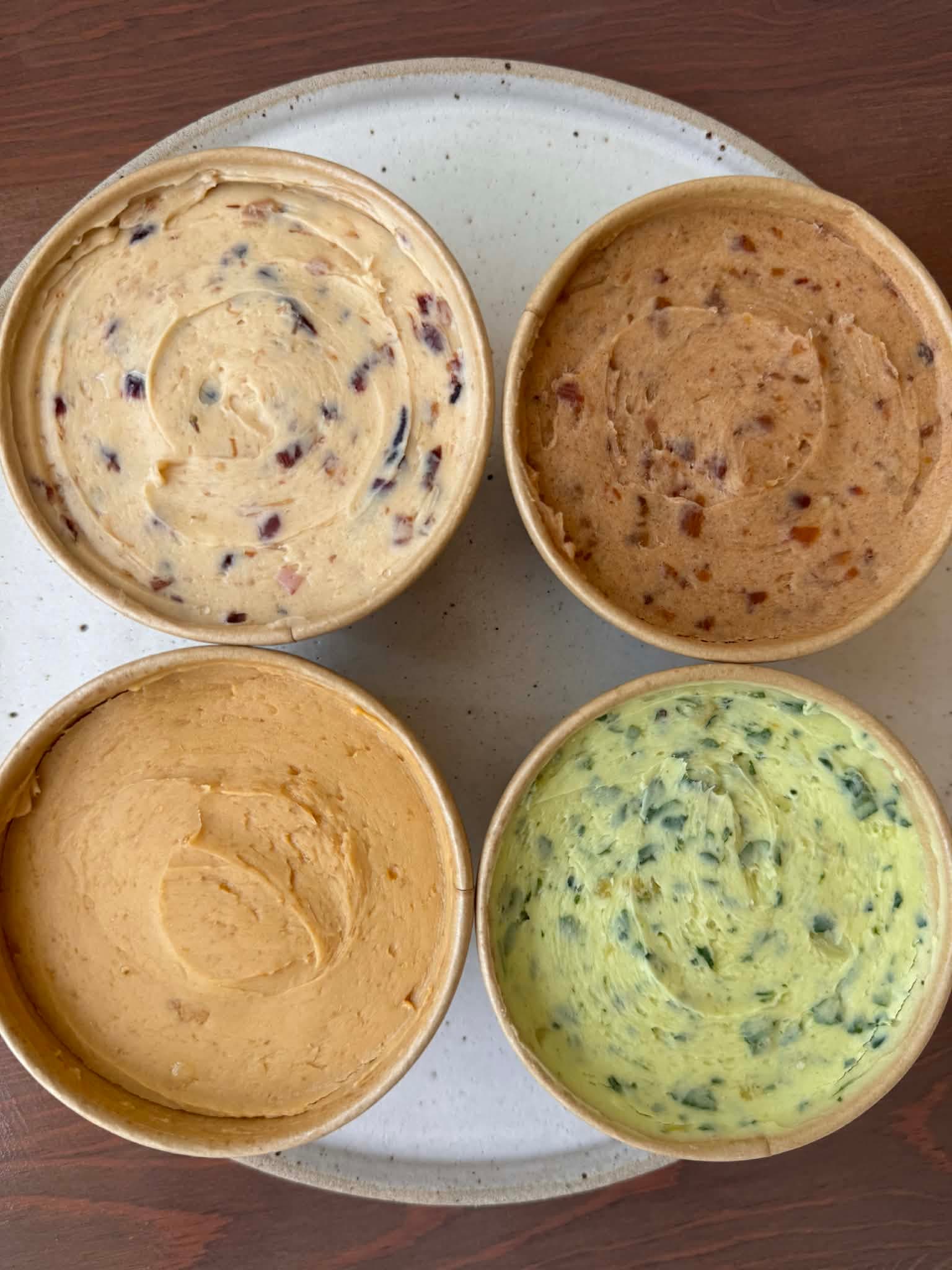 Four flavoured butters — Date & Cinnamon, Caramelised Onion, Marmite, Garlic & Parsley